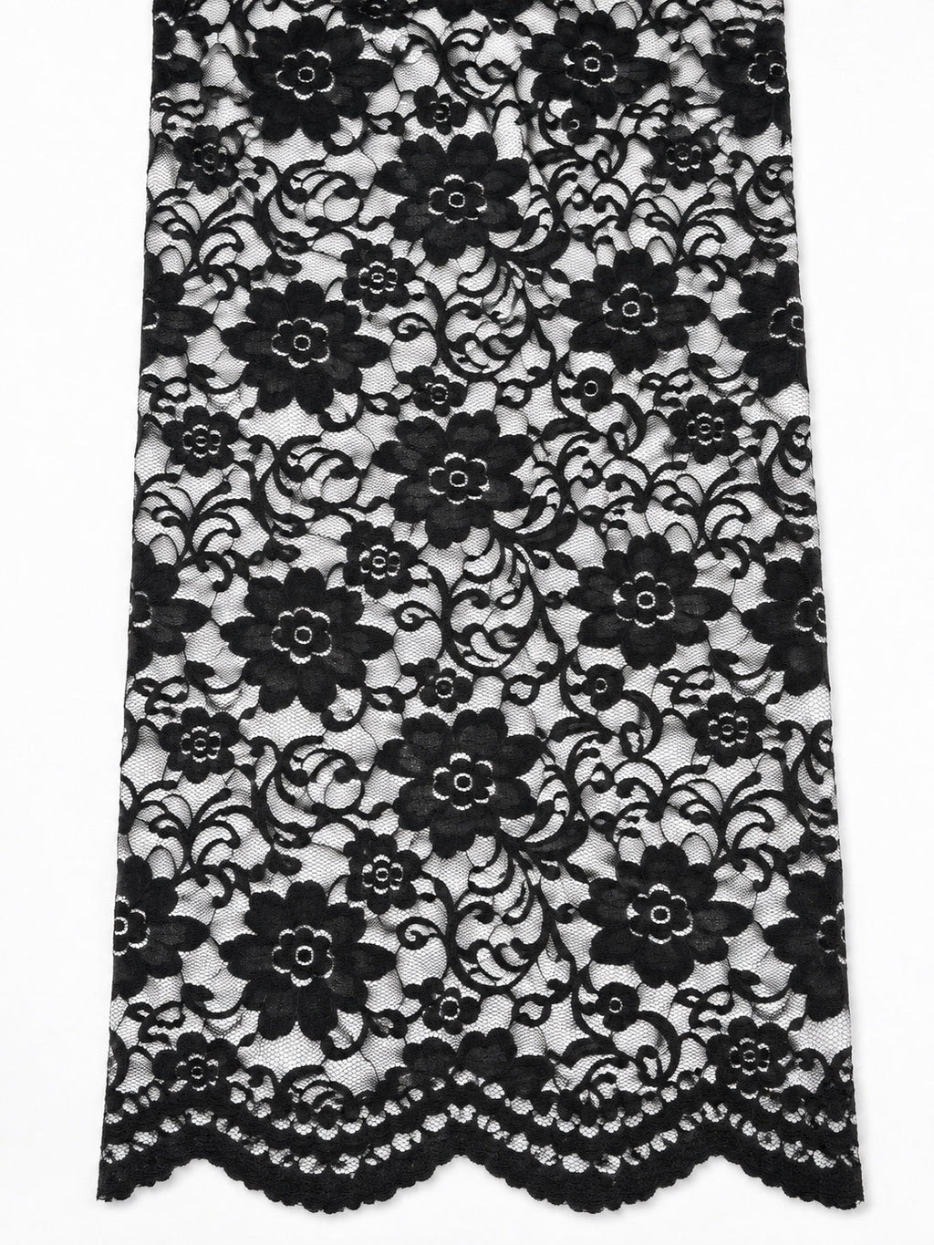 Close view of the Indonesian non-stretch lace floral design and scalloped border