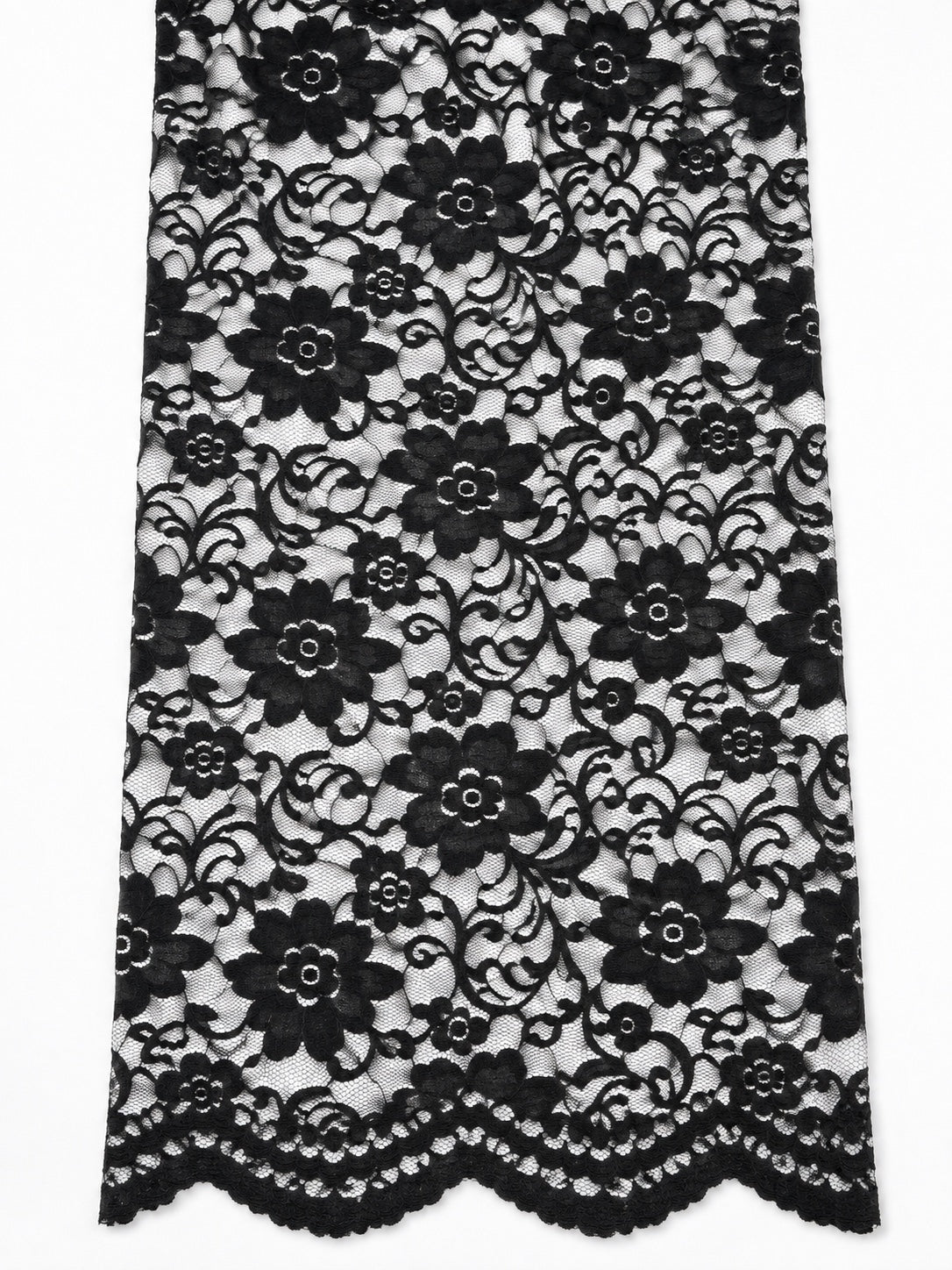Close view of the Indonesian non-stretch lace floral design and scalloped border