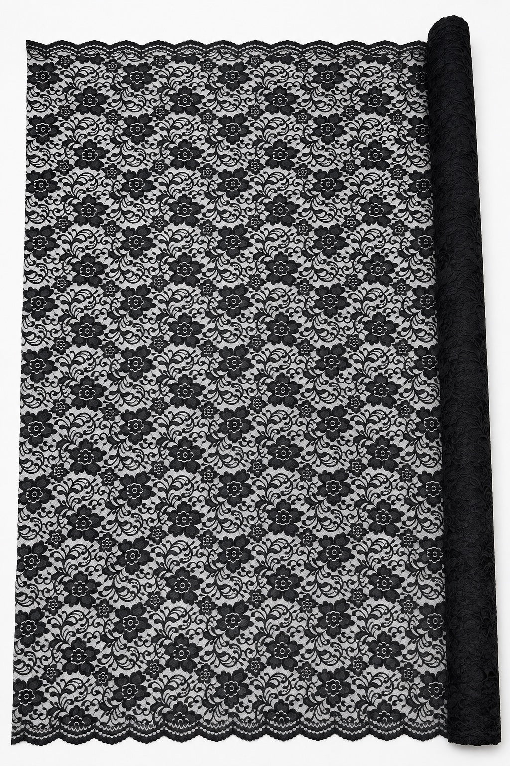 Black Indonesian lace displayed full width beside the roll to show the complete floral layout and both borders
